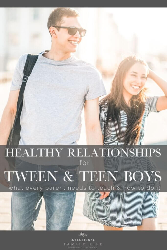 an attractive young teenage couple walking through town hand in hand, suggesting the concept of healthy relationships