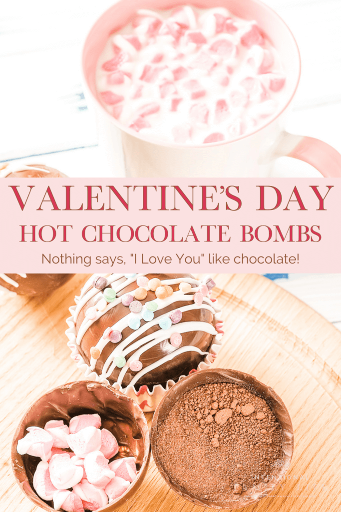 A delicious looking mug containing Valentines hot chocolate bomb with several hot chocolate bombs next to the mug
