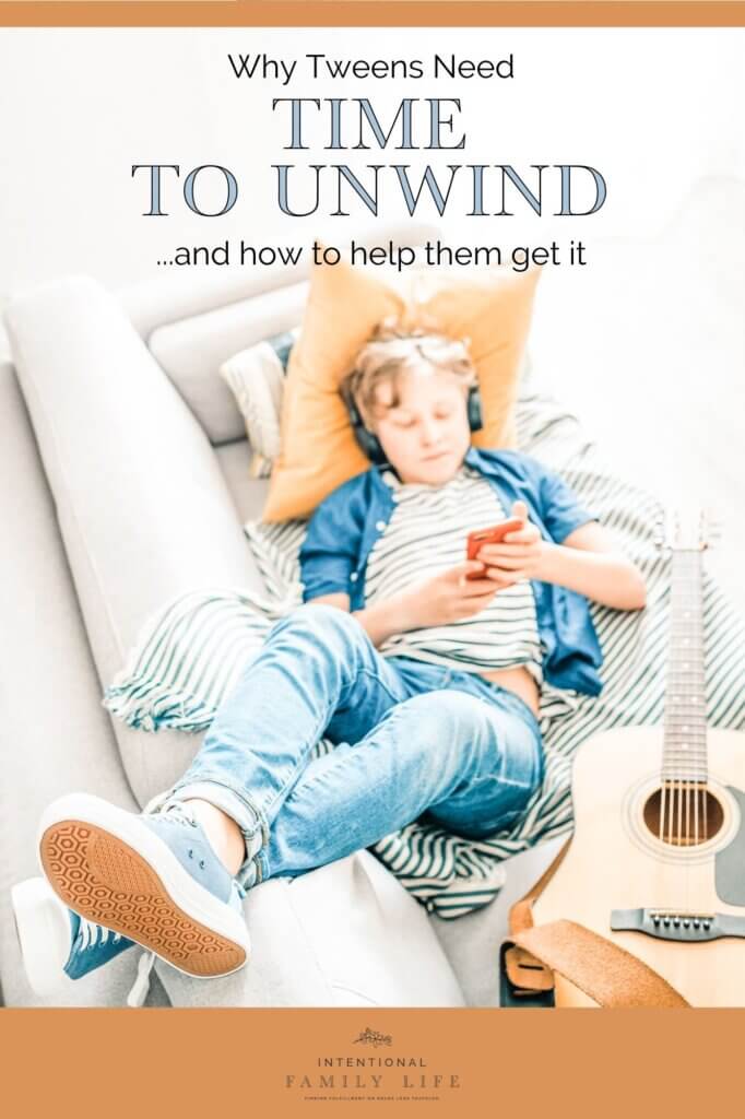 attractive young boy sitting on his sofa playing with phone suggesting stress management strategies