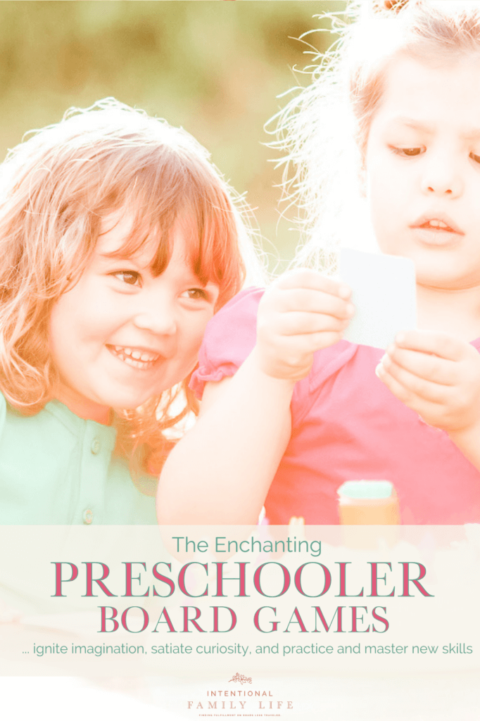 image of two happy preschool girls playing a board game - suggestive of the concept of preschool board games