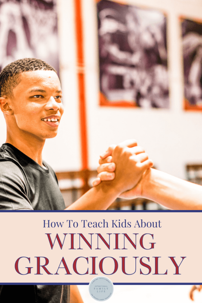 image of young african american boy in gym shaking hands with friend suggesting healthy competition skills for tweens